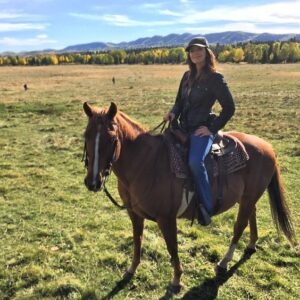 Michelle Morgan riding a horse as Lou Fleming on Heartland